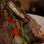 Slow-baked lamb with potatoes and rosemary