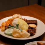 Beef rendang with rice and side dishes