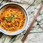 Hand-pulled noodles in chili oil with scallions