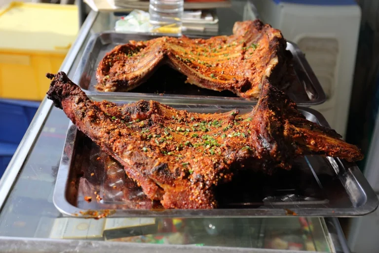 Hangi-Style Slow-Roasted Lamb Shoulder with Smoked Kumara and Charred Silverbeet