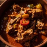 Guatemalan spiced pork stew in rich red sauce