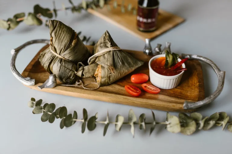 Steamed Banana Leaf Rice Parcels with Coconut and Jaggery