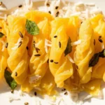 Gujarati Rolled Chickpea Flour Snack with Mustard Tempering